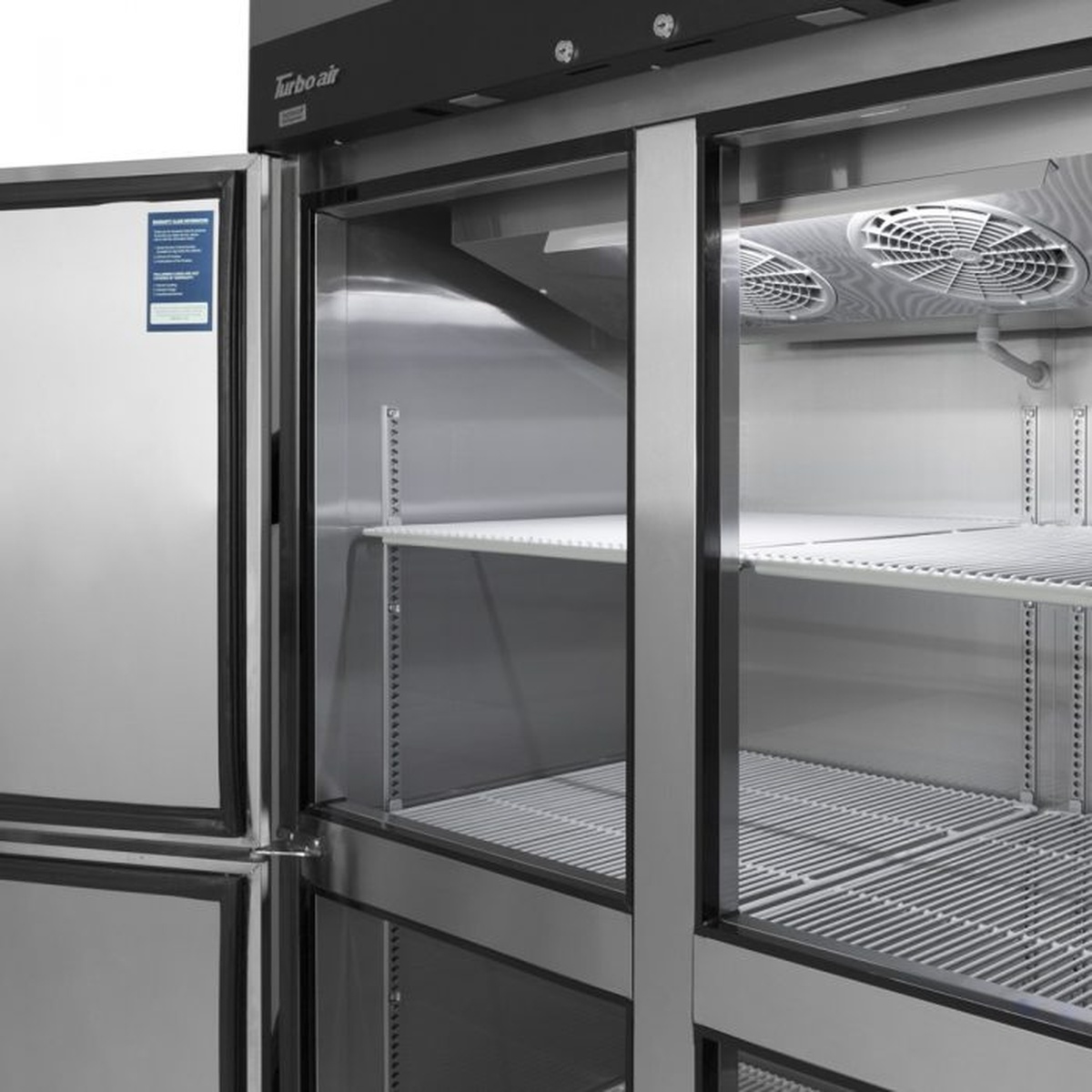 Interior view of the freezer with adjustable wire shelves and evaporator fans