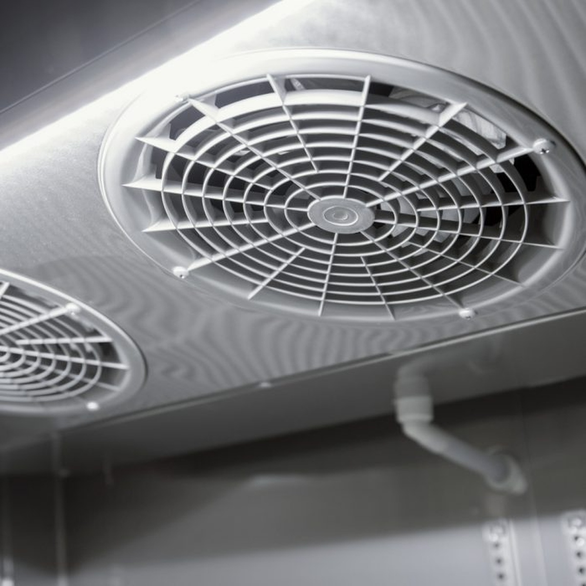 Ceiling-mounted evaporator fan assembly inside Turbo Air reach-in freezer
