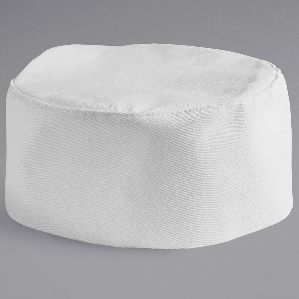 Mercer Culinary M60075WH white baker's skull cap pill box hat, front three-quarter view