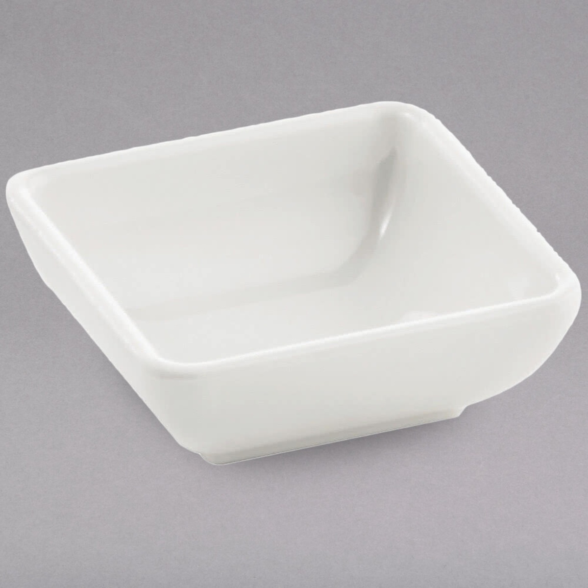 TableCraft MB21 white square melamine sauce bowl shown at an angle, displaying its smooth rounded edges and shallow interior
