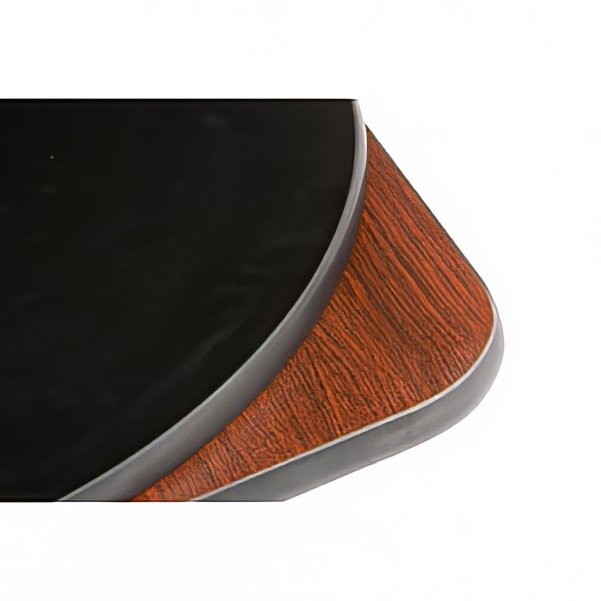 Close-up corner of Oak Street MB2430 reversible melamine table top showing black surface on one side and mahogany wood-grain finish on the other, with extruded black rubber T-mold edge