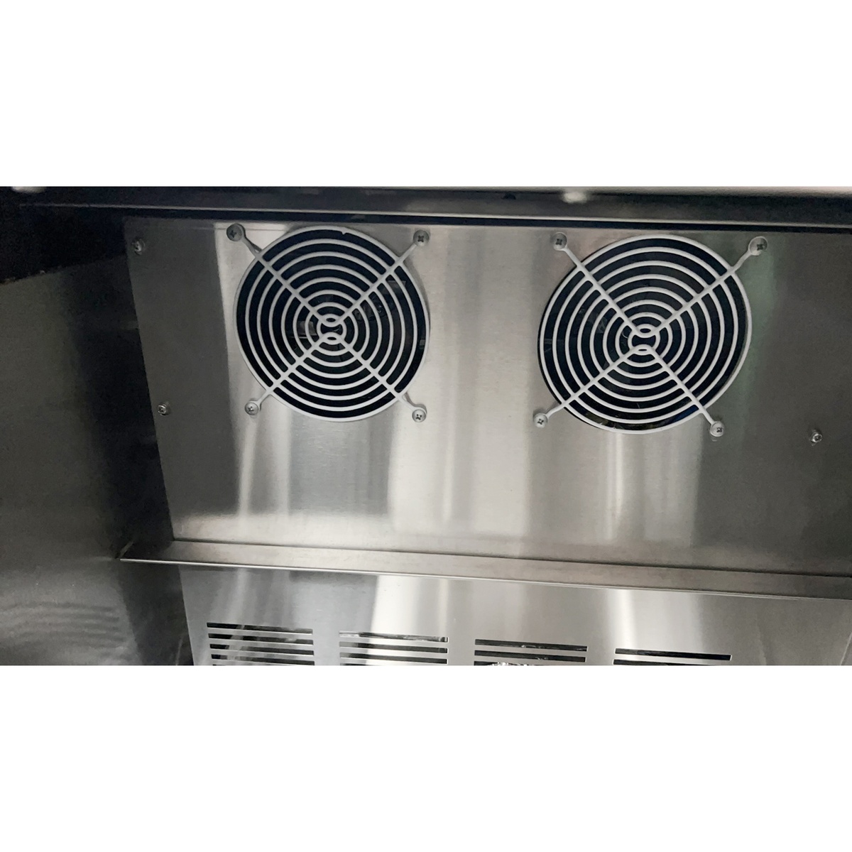 Dual evaporator fans inside the Atosa MBGF24GR glass froster providing consistent cold air circulation