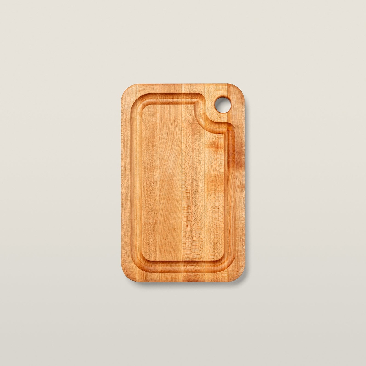 John Boos Prestige maple cutting board top view showing deep juice groove and finger grip hole