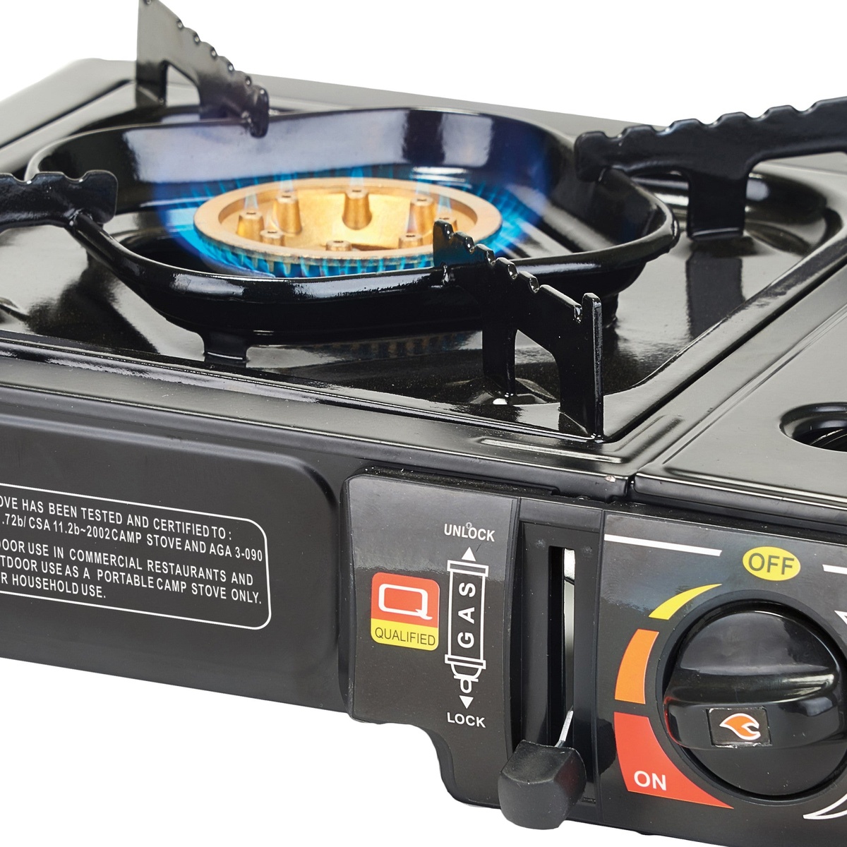 Close-up of Winco PGS-1K solid brass burner with blue flame ignited, showing electronic ignition and control knob