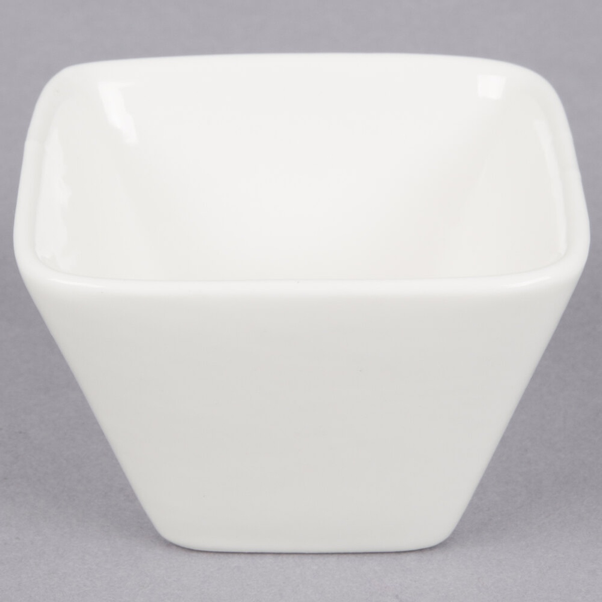 American Metalcraft PORB29 white square porcelain sauce cup, front view showing glossy finish and tapered walls