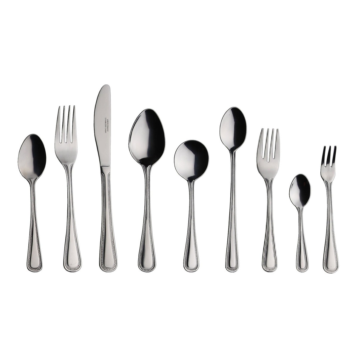 Full Libertyware Primrose flatware collection including spoons, forks, and knife arranged together