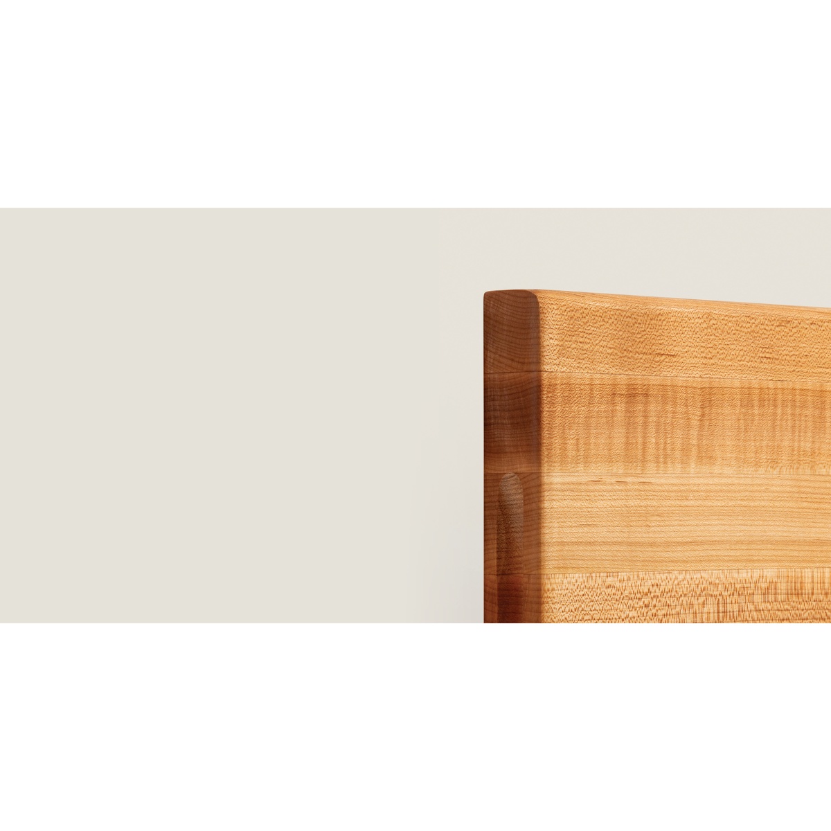 Wide-angle corner detail of the John Boos R01 maple cutting board showing oil finish and edge grain