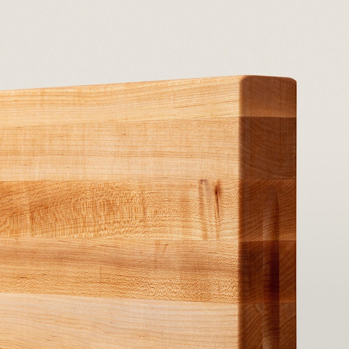 Close-up detail of John Boos RA02 edge-grain maple wood construction showing tight grain pattern