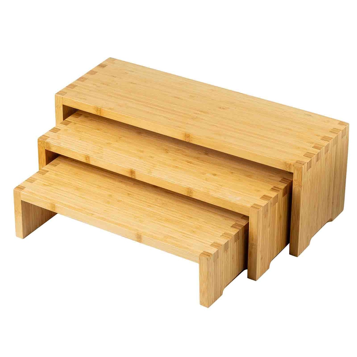 Angled close-up of three TableCraft bamboo cascade risers showing finger-joint corner detail