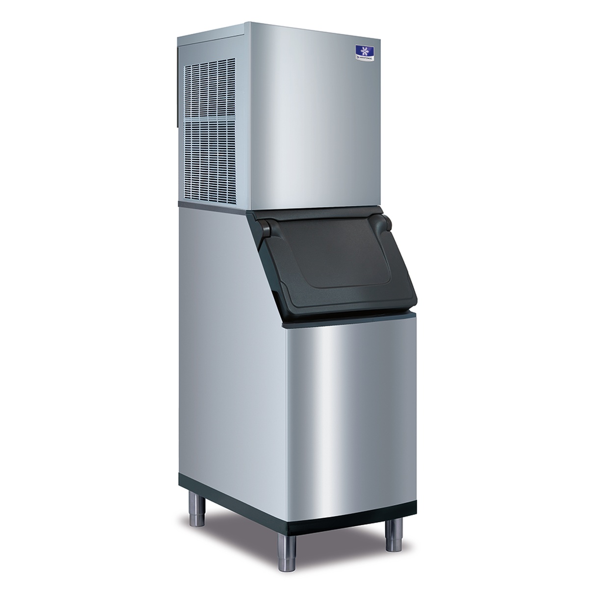 Manitowoc flake ice machine head mounted on a stainless steel ice storage bin with lift-up door