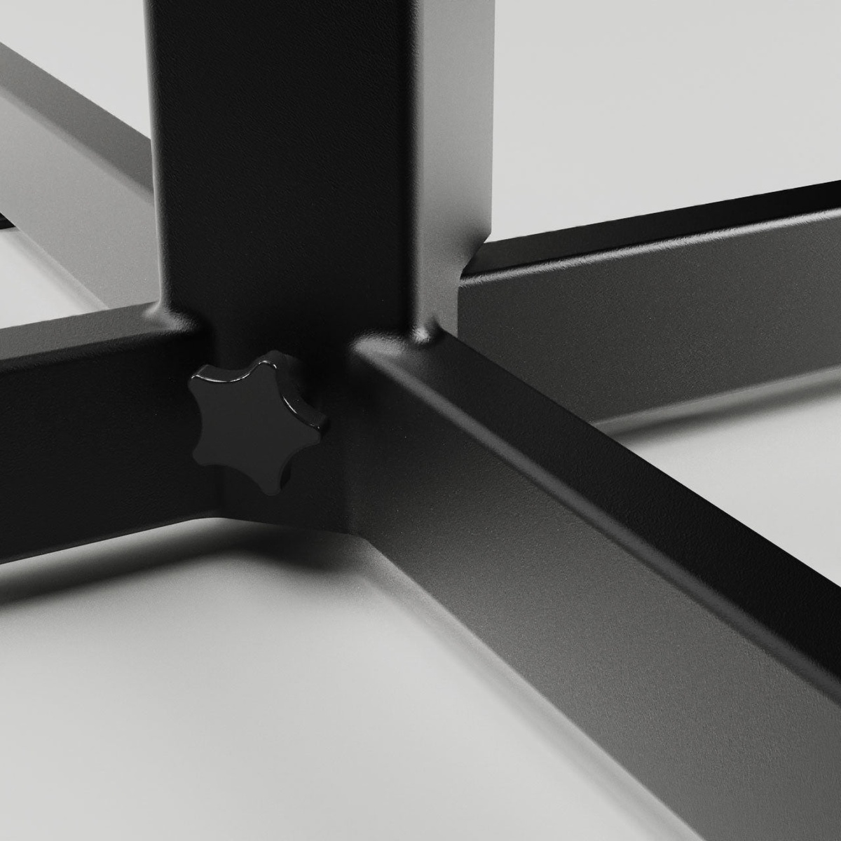 Close-up of the central joint and tension knob on the table base