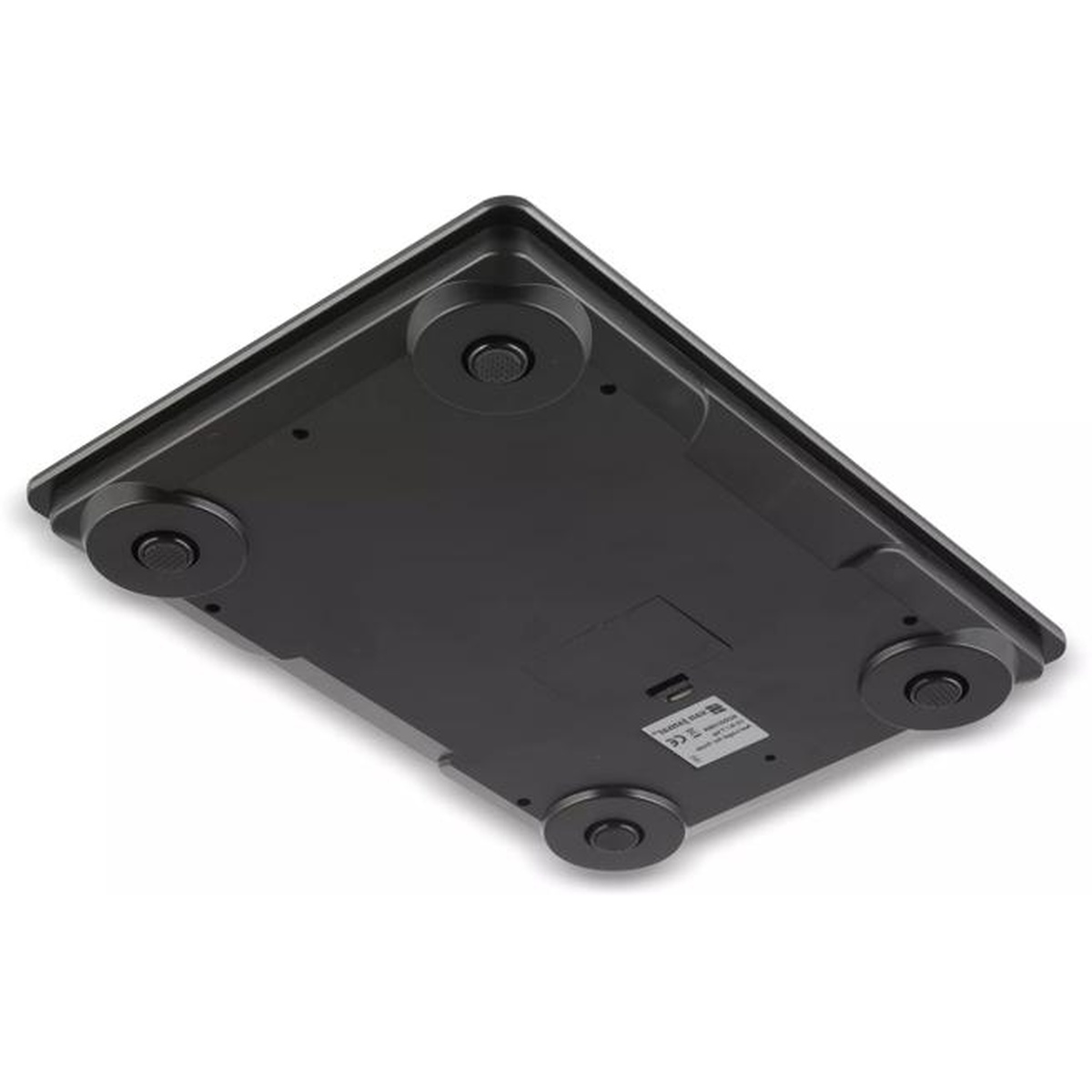 Underside of digital scale showing four feet and battery compartment