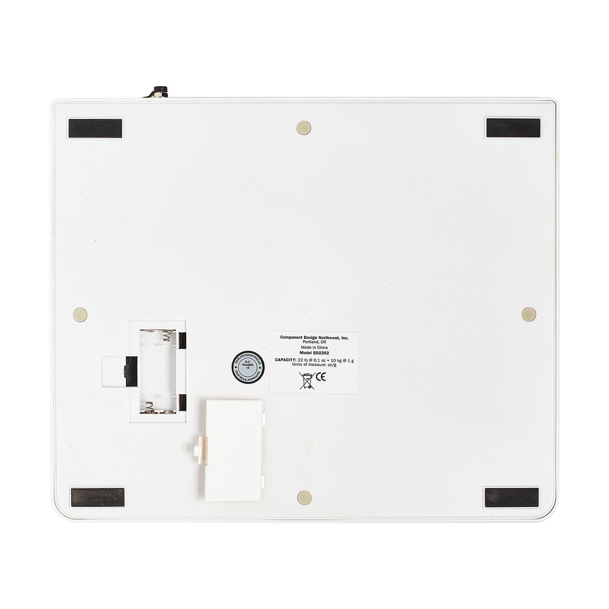 CDN SD2202 scale bottom view showing battery compartment, model label, and non-slip feet