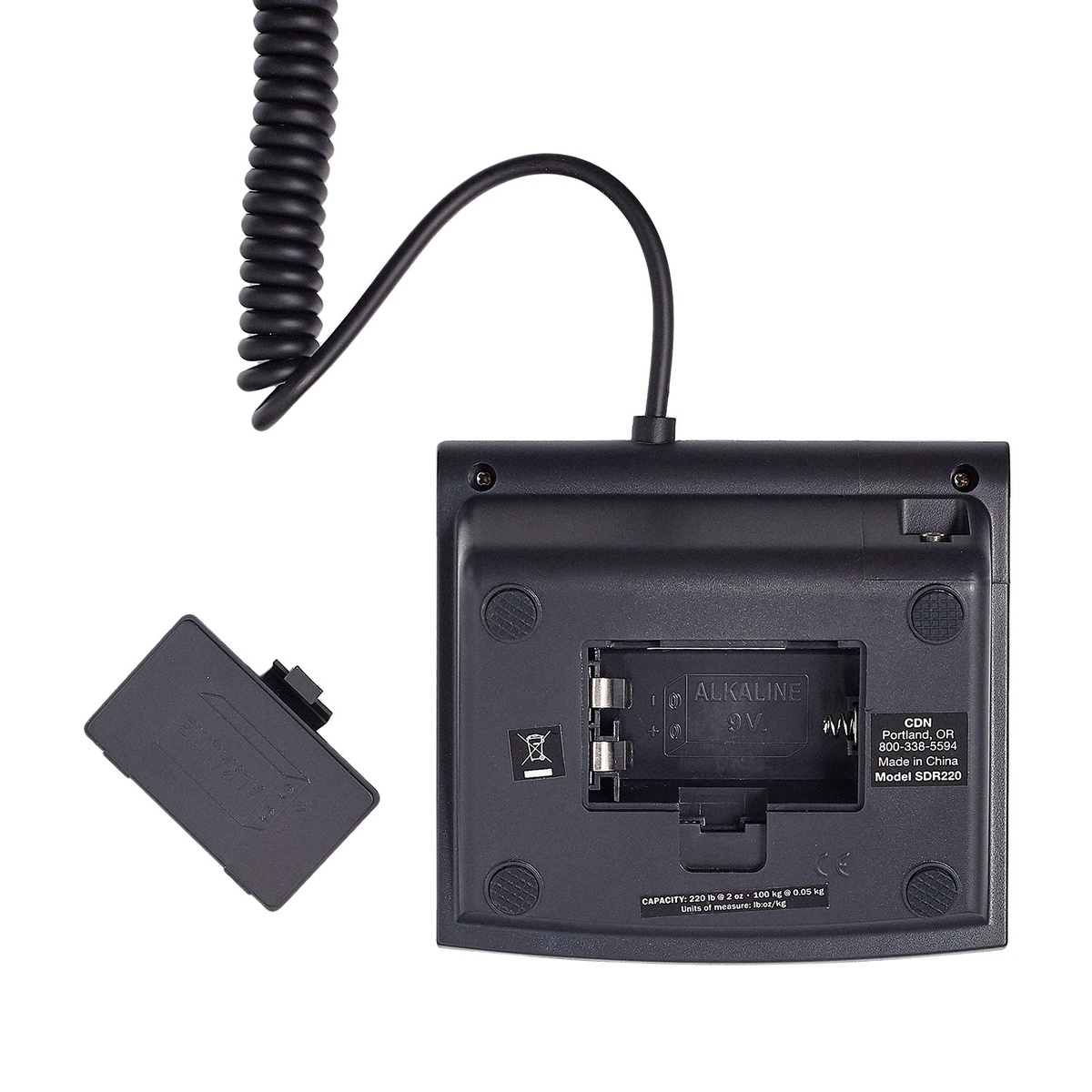 Back of CDN SDR220 extendable display unit with battery compartment open showing 9V alkaline battery slot