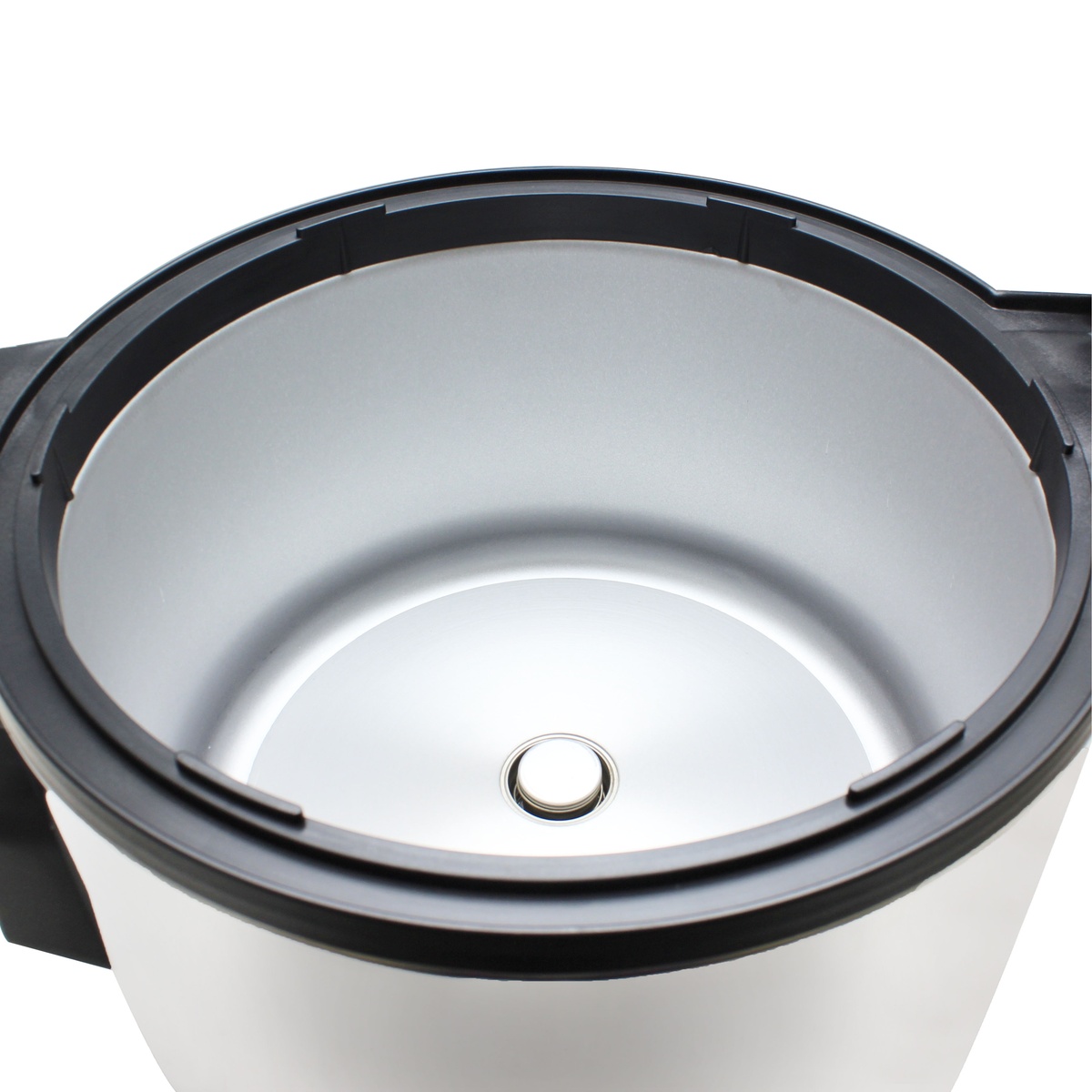 Close-up view inside rice cooker body showing inner pot opening