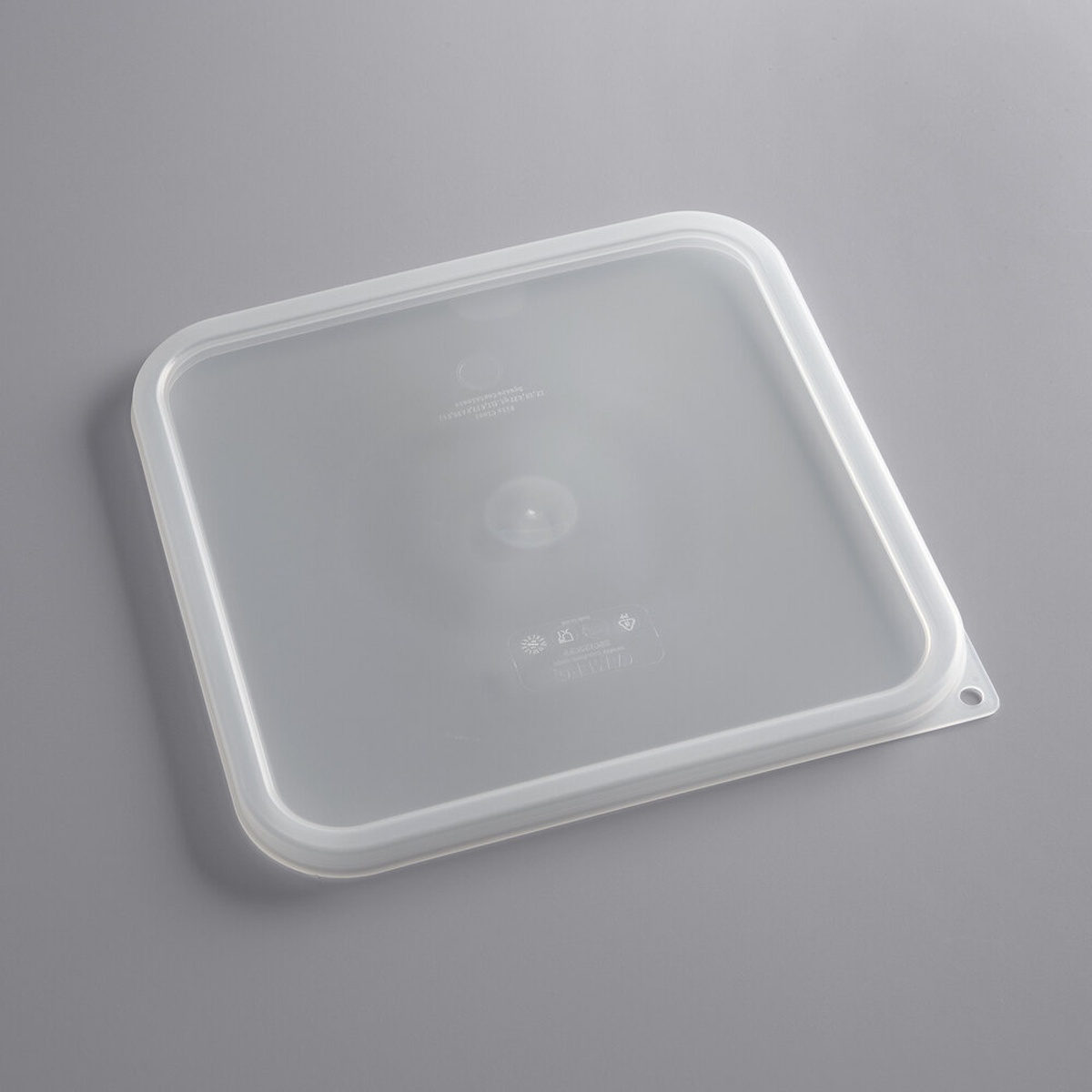 Cambro SFC12SCPP190 translucent square polypropylene seal lid, top-down angled view showing thumb tab and hanging hole