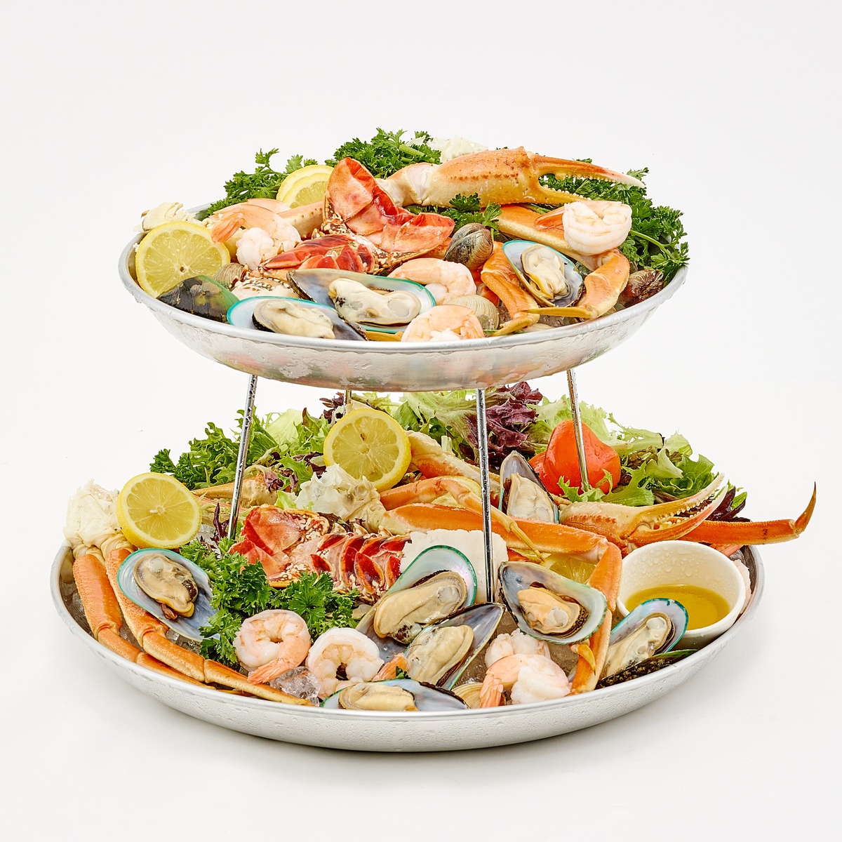 Two-tier seafood tower display using Winco SFR-7 rack stacked with ASFT-series trays loaded with shrimp, crab, mussels, and garnishes