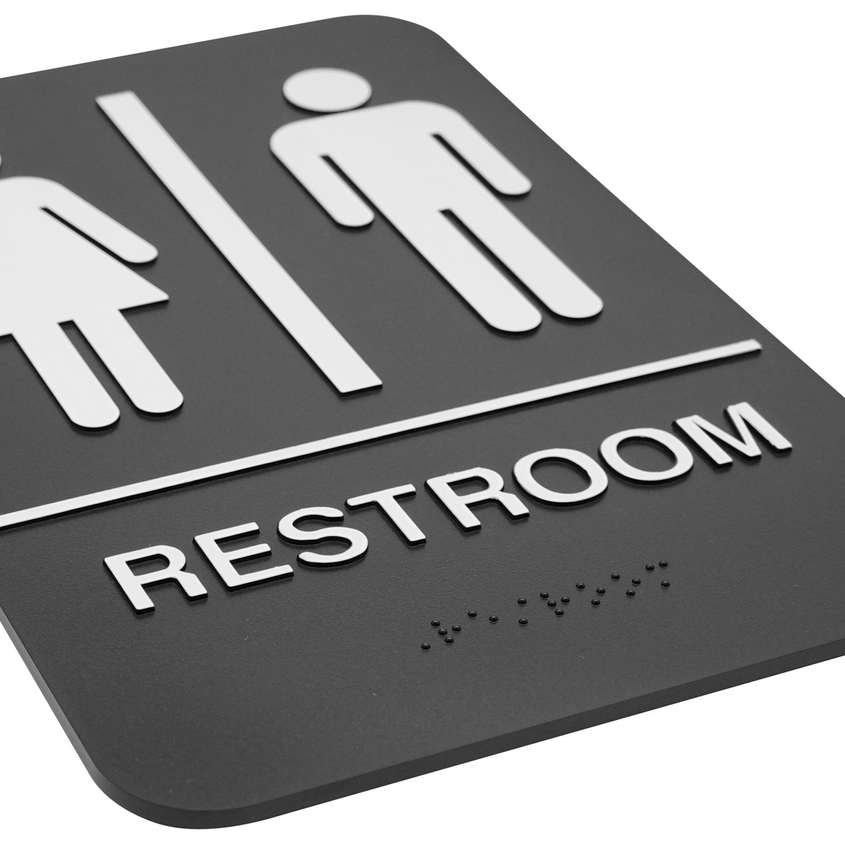Close-up angled view of Winco SGN-603 restroom sign showing raised white symbols, RESTROOM text, and Braille dots