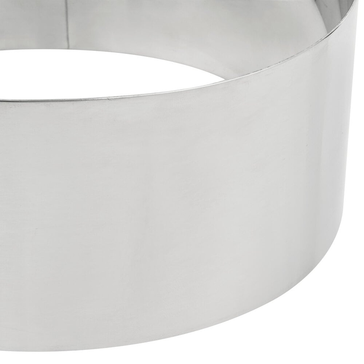 Close-up detail of the polished stainless steel surface and curved wall of the American Metalcraft SR6073 cake ring