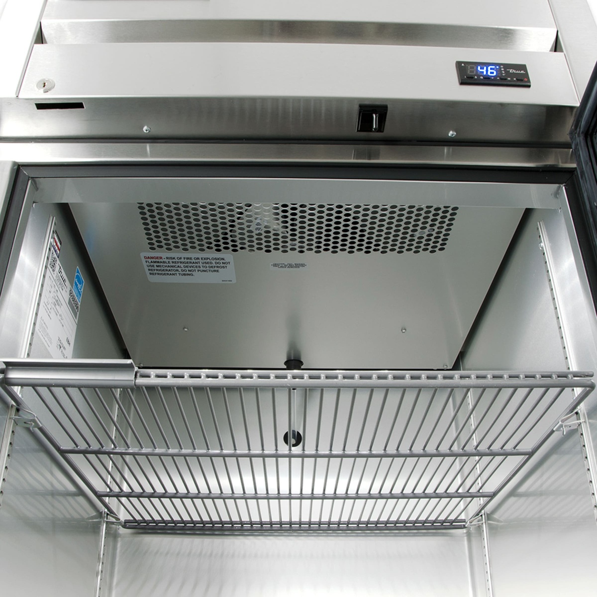 Interior top view of True refrigerator showing fan cover and digital temperature display