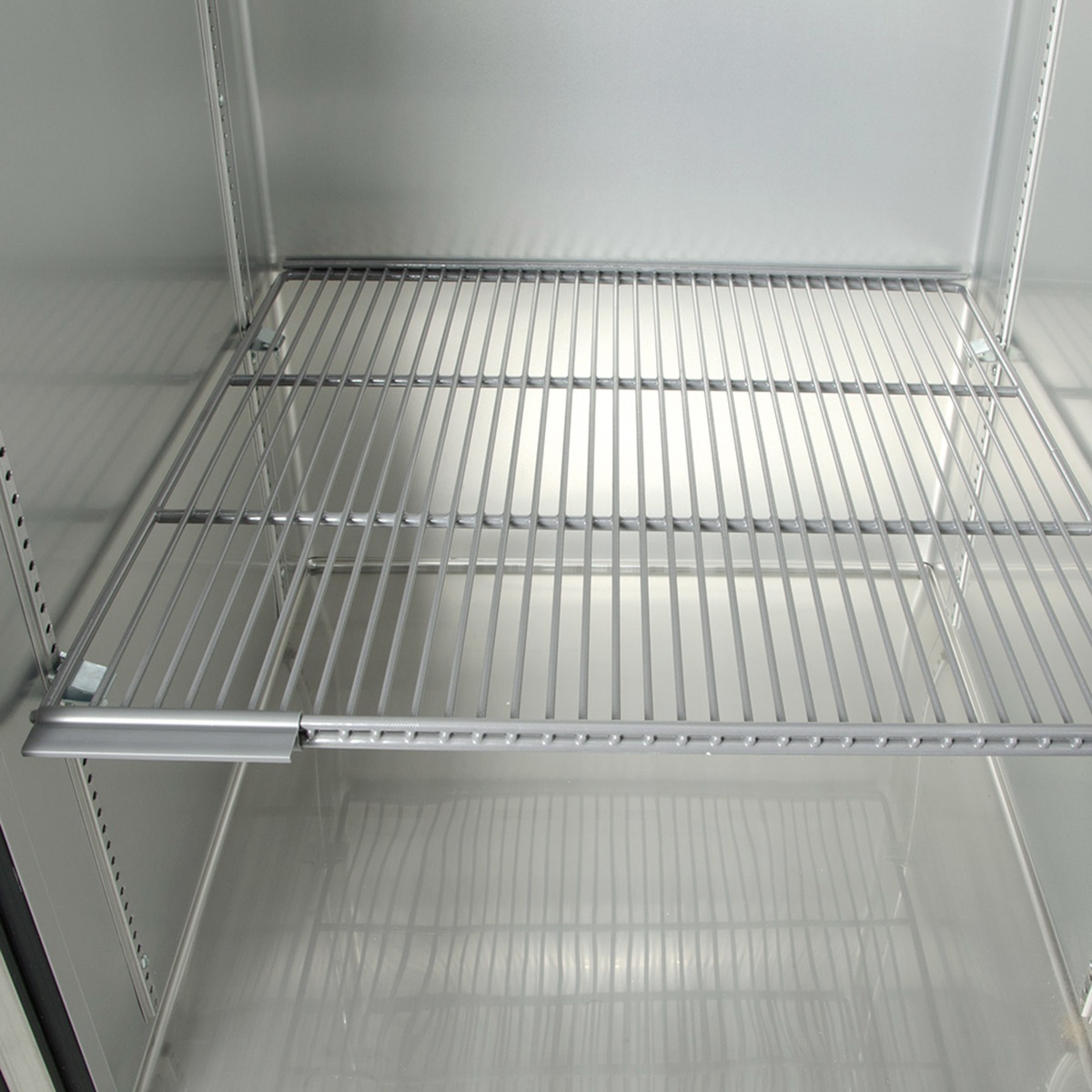 Close-up of adjustable wire shelf inside True T-23-HC refrigerator