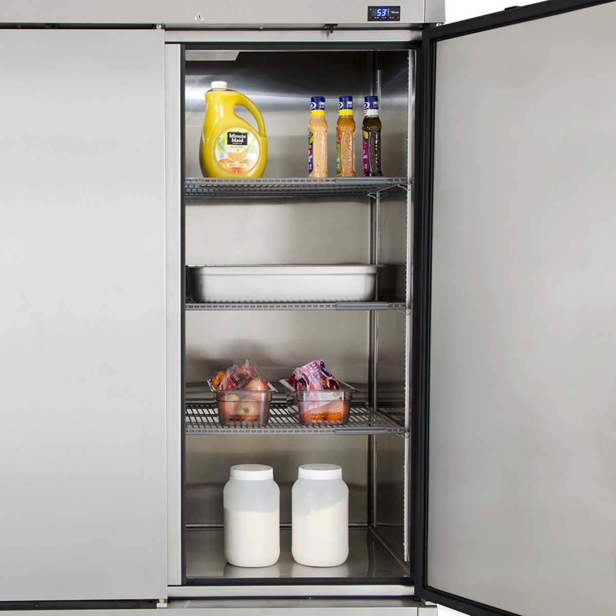 Inside view of True T-72-HC refrigerator section with shelves and stored food items