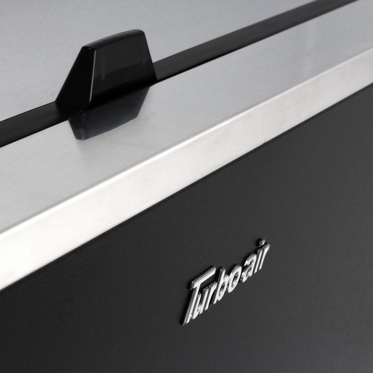 Close-up of stainless lid edge and Turbo Air logo on black exterior
