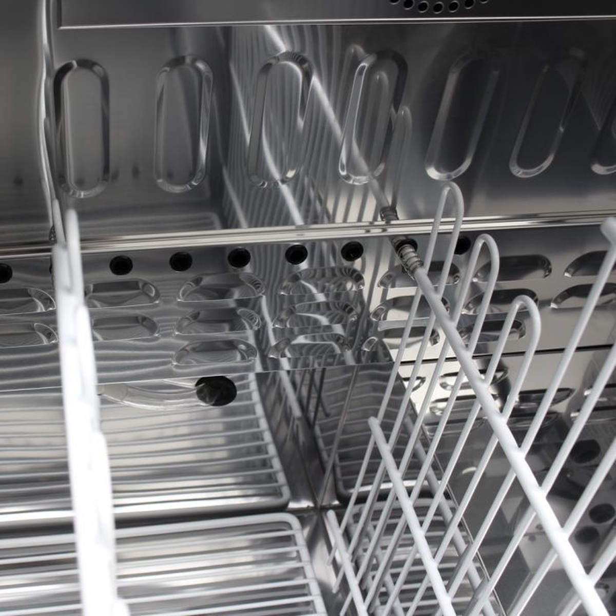 Interior view of Turbo Air bottle cooler showing dividers and stainless interior