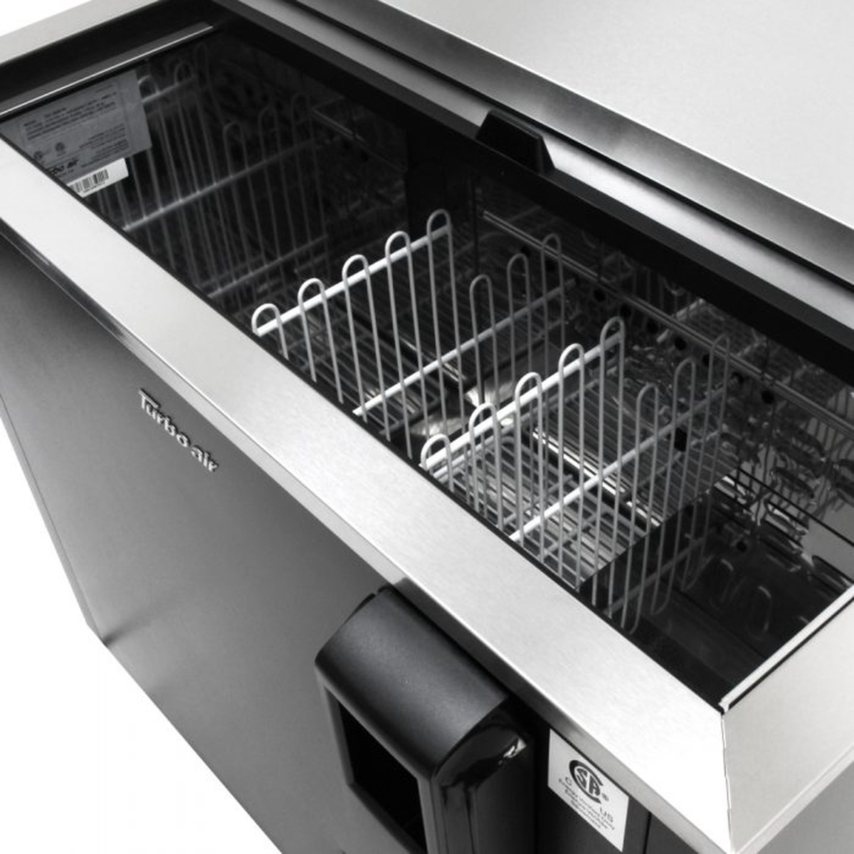 Interior view of Turbo Air TBC-65SB-N6 bottle cooler showing stainless steel walls and PE-coated wire dividers