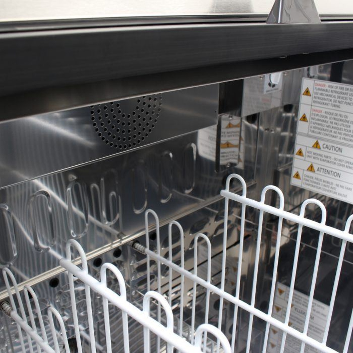 Stainless steel interior of Turbo Air bottle cooler with coated wire dividers