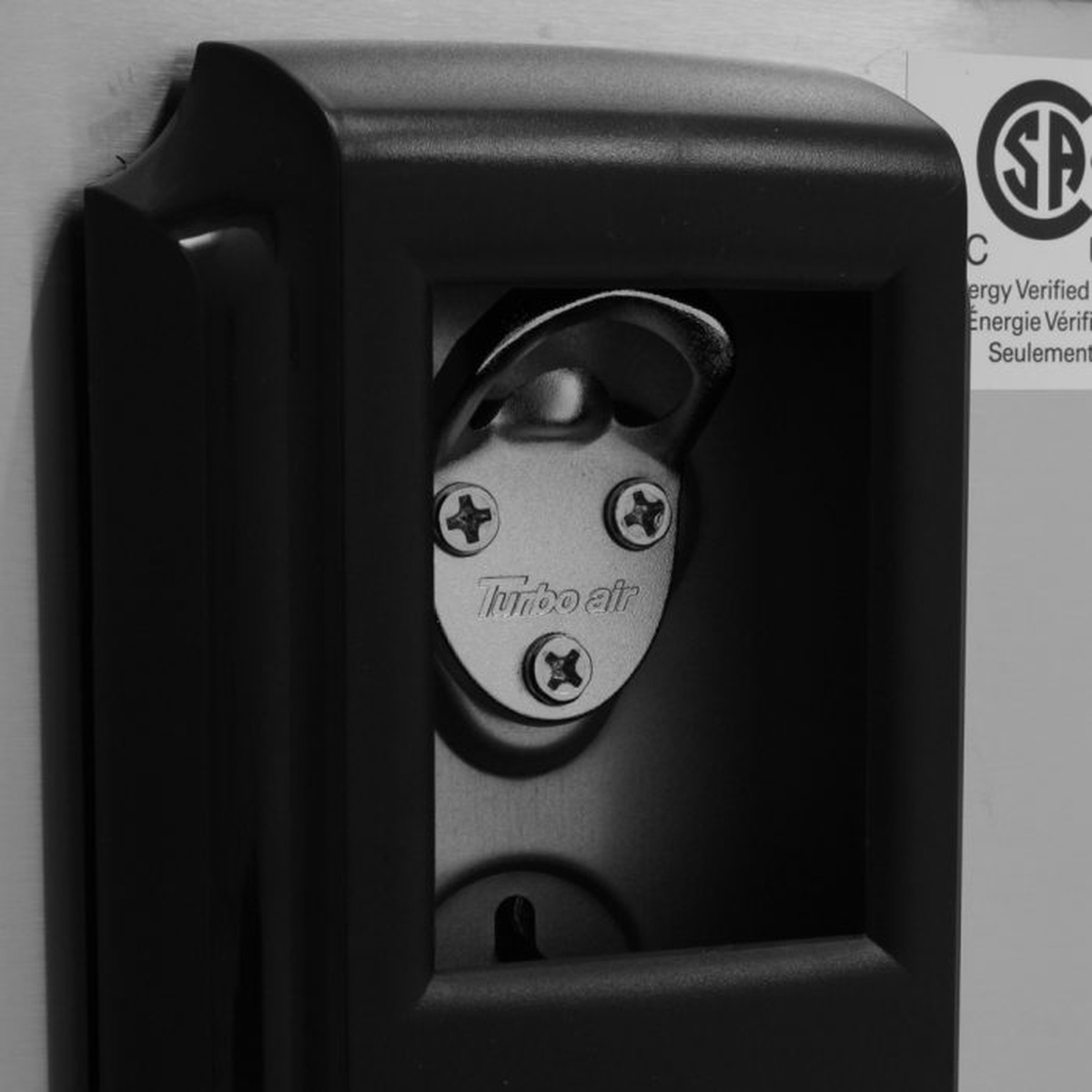 Close-up of built-in bottle opener on Turbo Air bottle cooler