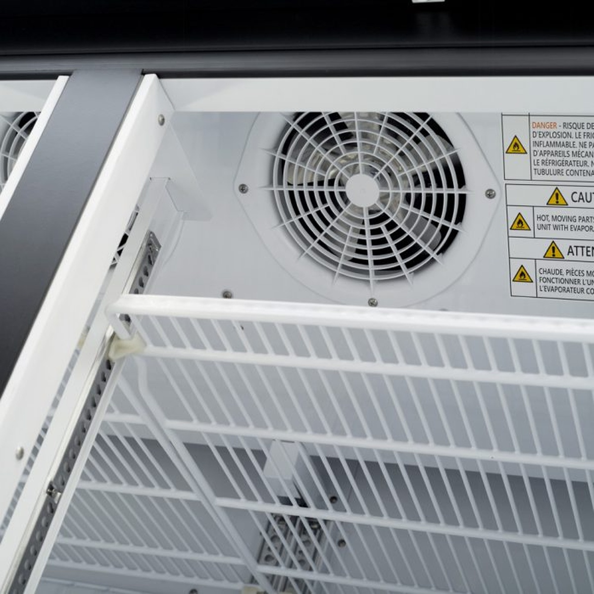 Interior evaporator fan area behind shelves