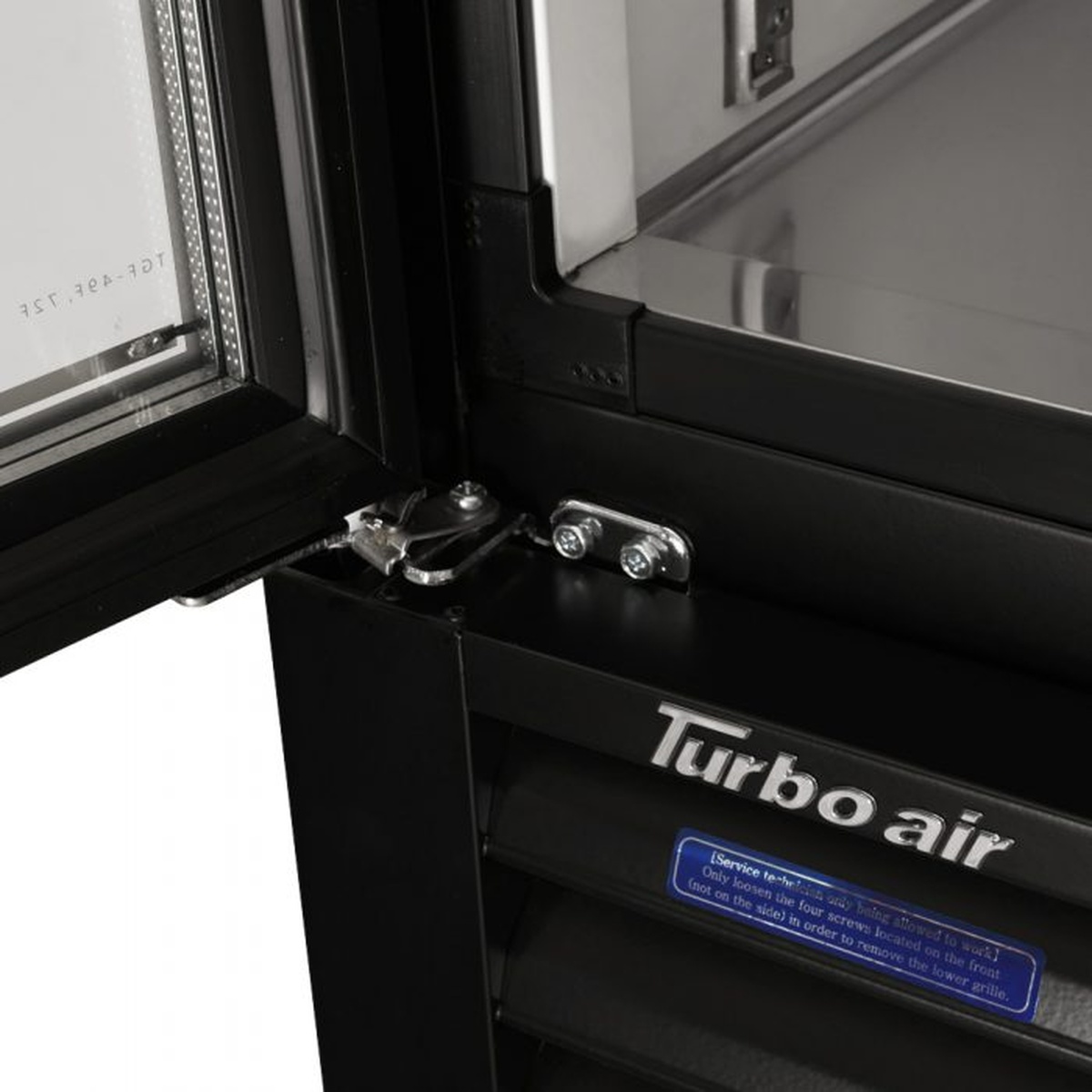 Close-up of door hinge and glass door frame on merchandiser freezer