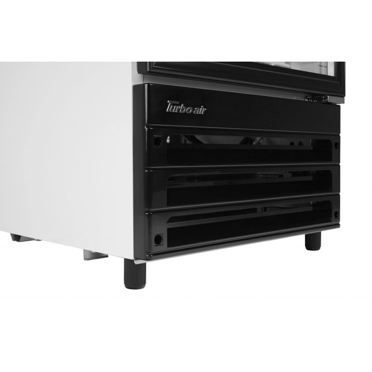 Lower front base of Turbo Air merchandiser refrigerator showing bottom-mounted system area
