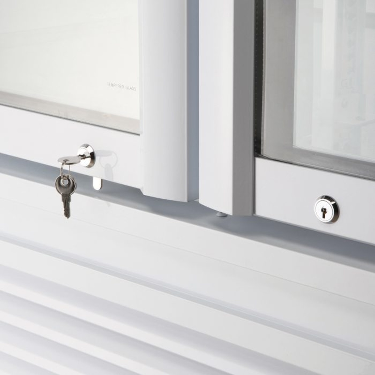 Close-up of door locks on glass doors of the merchandiser refrigerator
