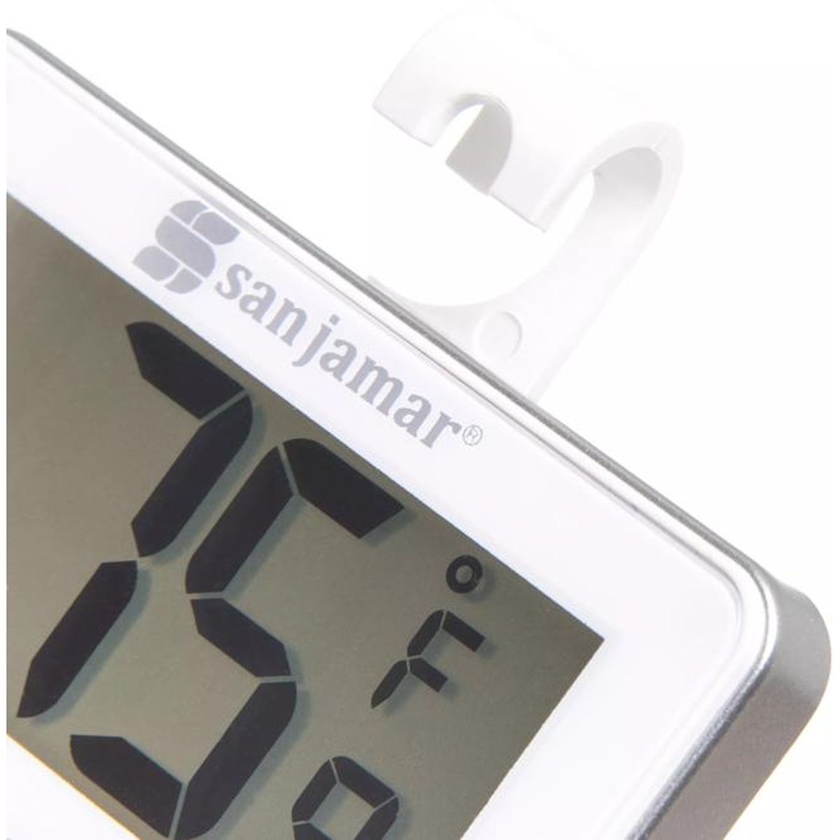 Close-up of San Jamar Escali THDGRF thermometer top-right corner showing white hanging hook and digital display reading degrees Fahrenheit