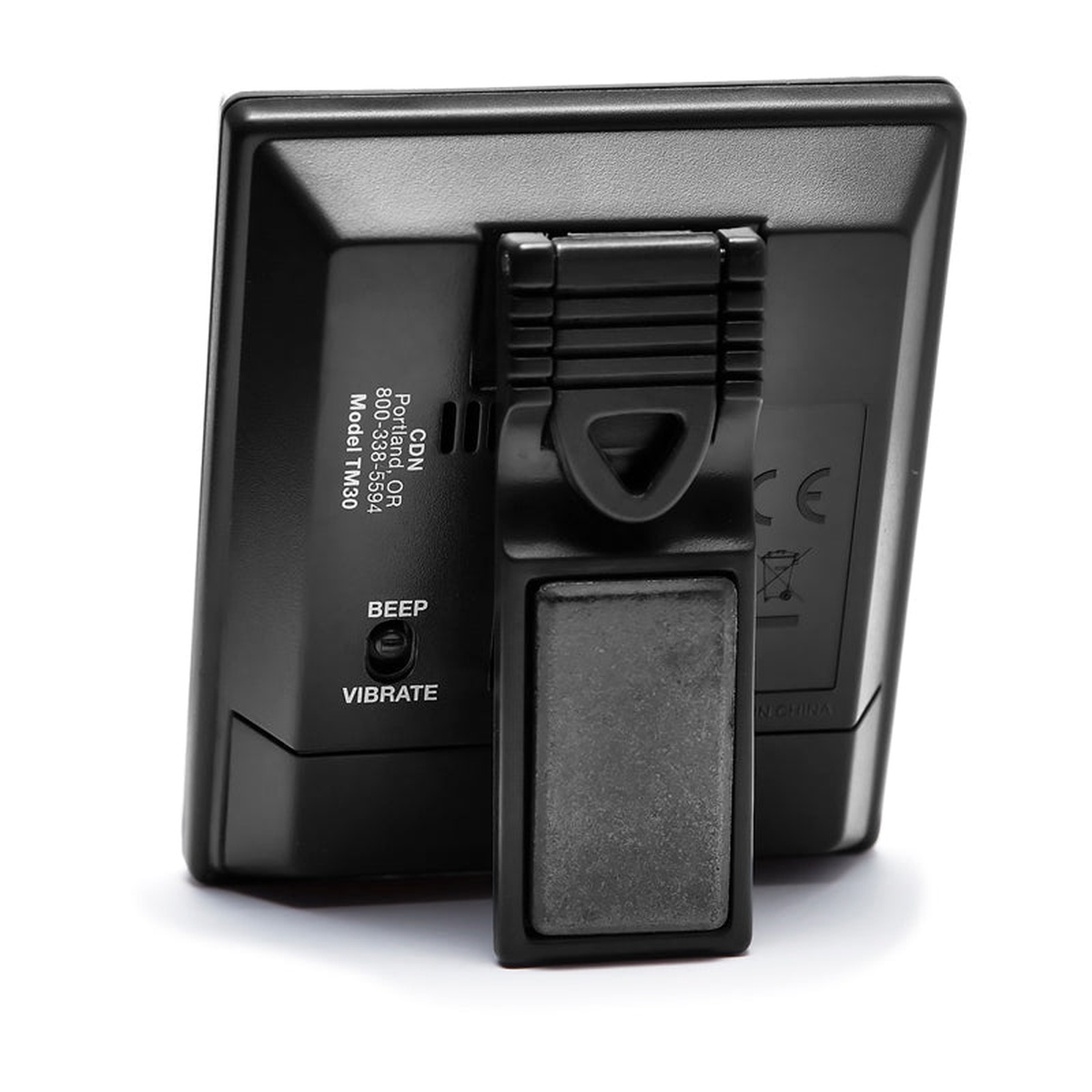 CDN TM30 timer back view showing built-in magnet, beep and vibrate alarm switch, and model label