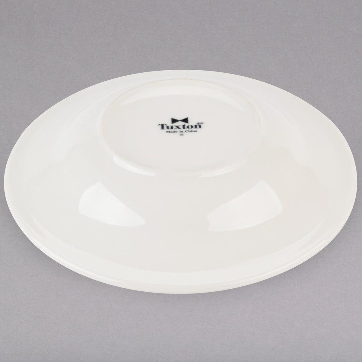 Tuxton TRE-003 rim soup bowl bottom showing Tuxton brand stamp