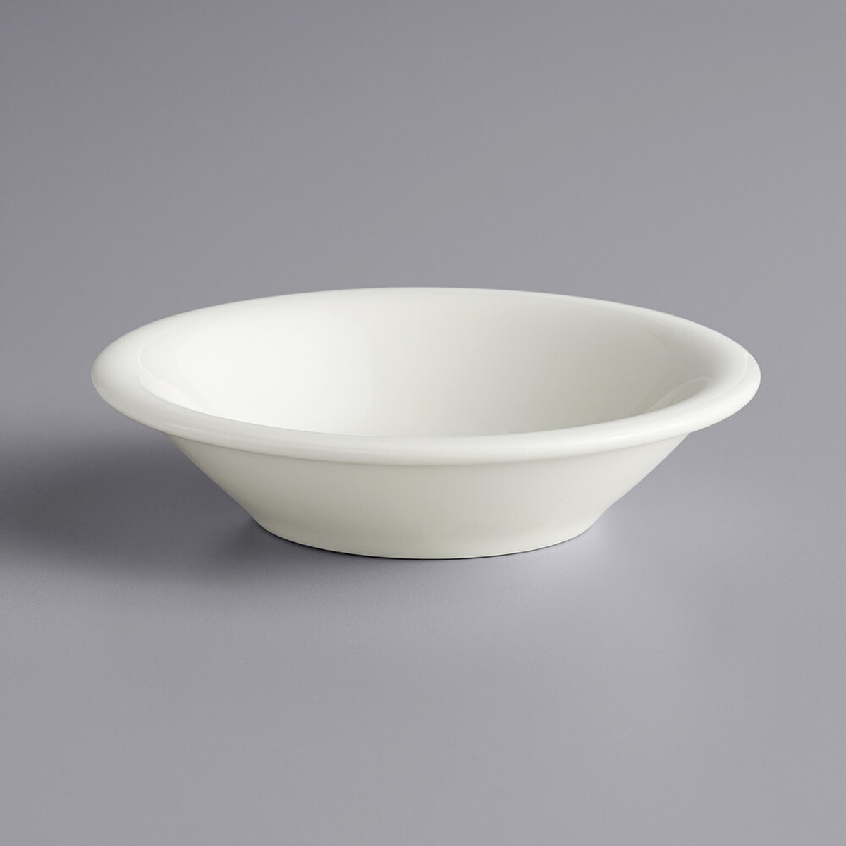 Tuxton TRE-011 eggshell china fruit dish, round, shallow bowl profile on gray background