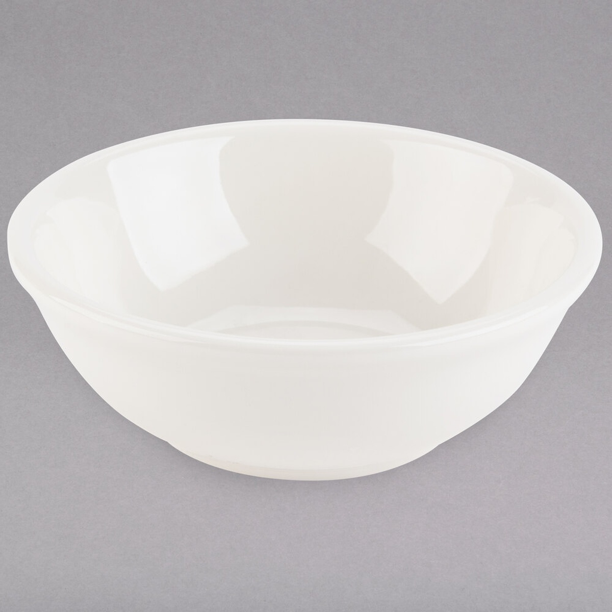 Tuxton TRE-015 eggshell china nappie bowl, round, 13 oz., shown on a neutral background