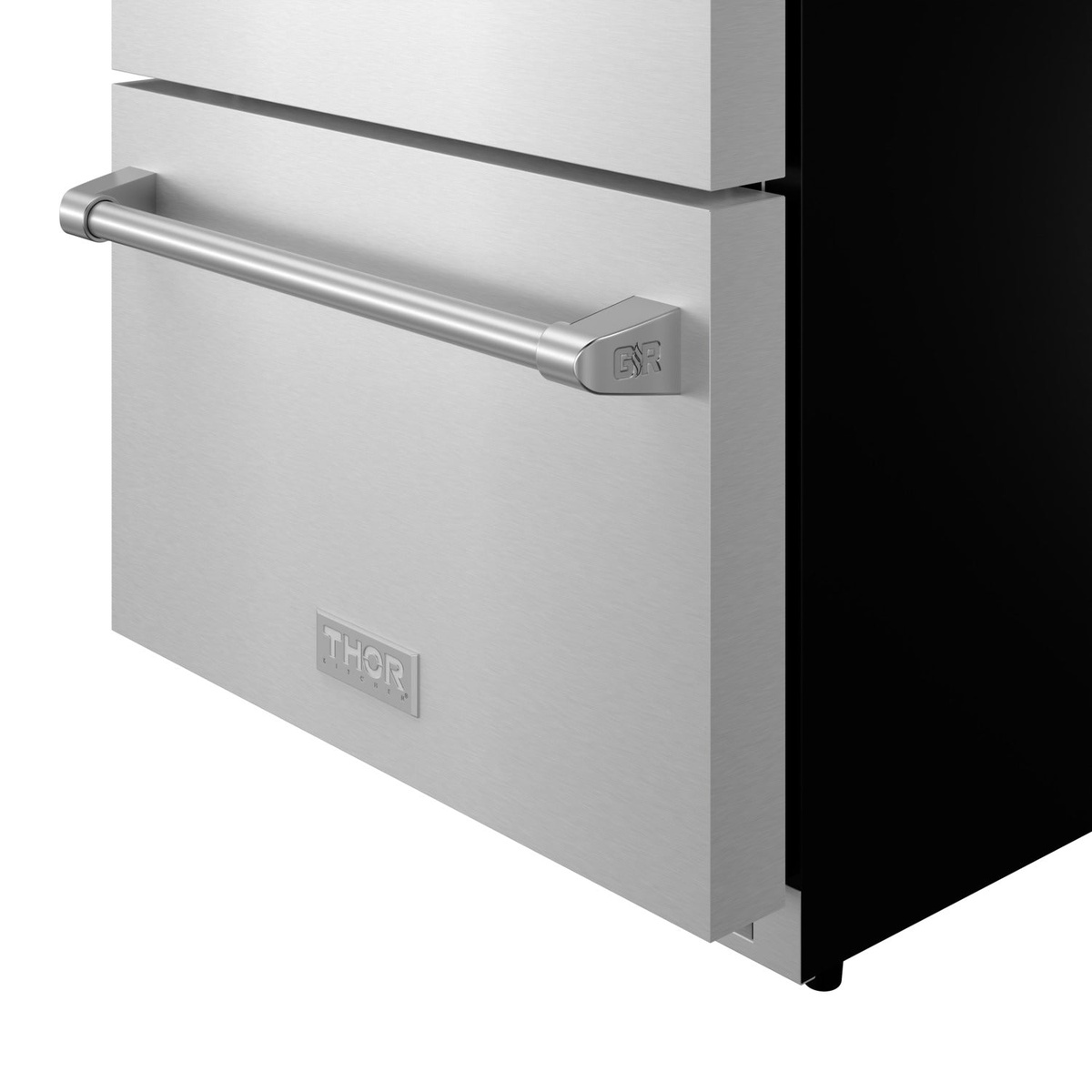 Close-up detail of Thor Kitchen TRF24U stainless steel bar handle and Thor branding badge on lower drawer