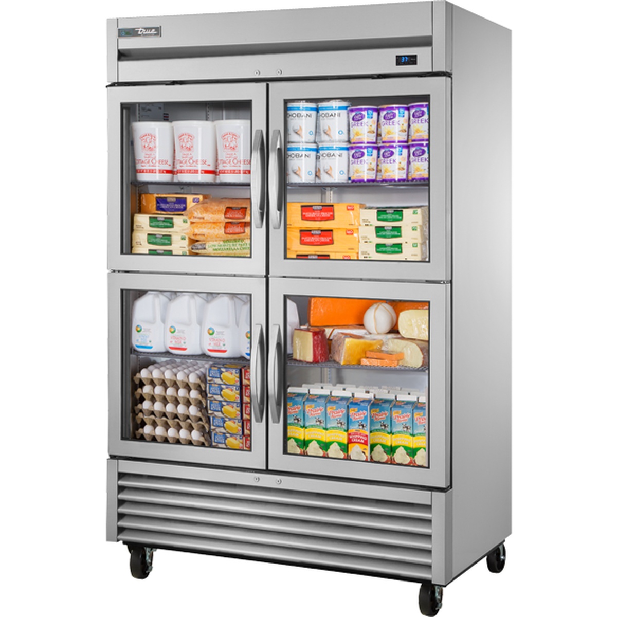 True TS-49G-4-HC~FGD01 two-section stainless steel reach-in refrigerator with four framed glass half doors, displayed stocked with dairy and food items on adjustable wire shelves