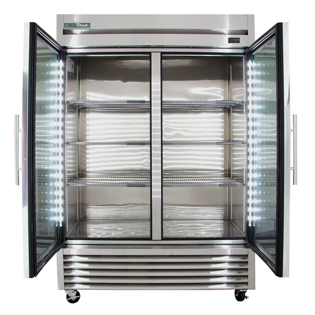 Open True glass door refrigerator showing LED interior lighting and adjustable wire shelves