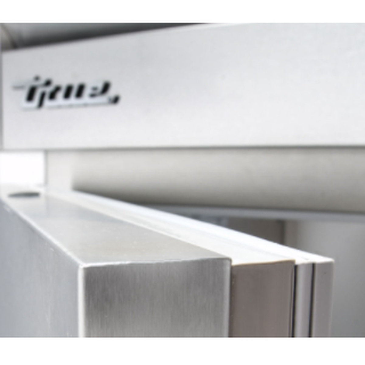 Close-up of True brand stainless steel door handle and exterior surface detail on the TSSU-72-18M-B-HC prep table