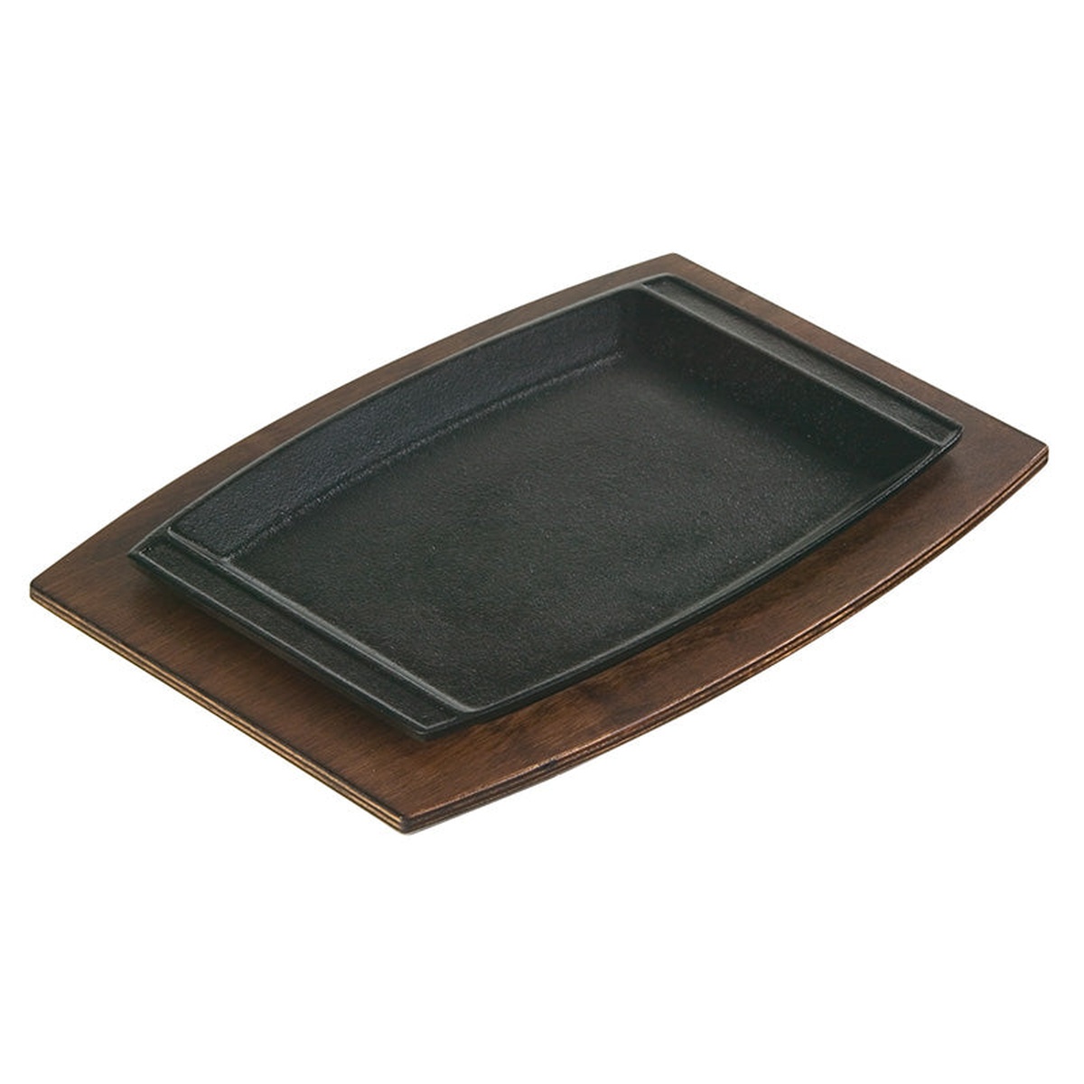 Lodge cast iron sizzle platter seated in the UCPU walnut wood underliner on white background