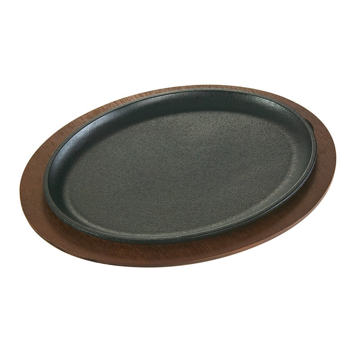 Lodge oval cast iron server seated in walnut wood underliner, shown on white background