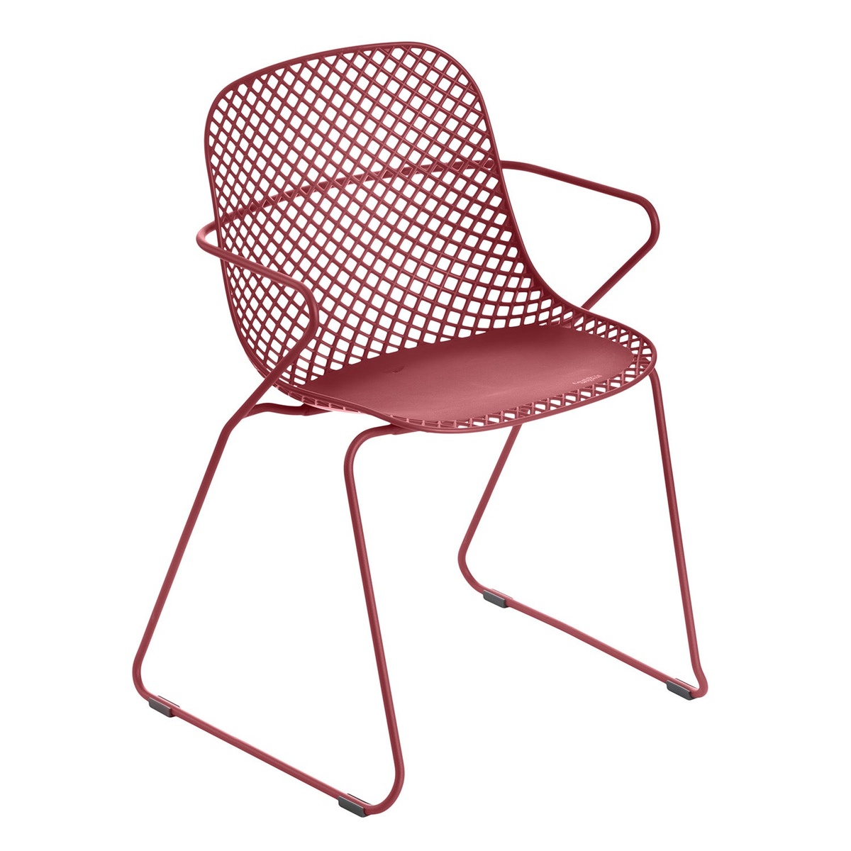 Grosfillex Ramatuelle 73 Armchair in Rouge Bossa Nova, three-quarter view showing lattice back, solid seat, and sled steel legs