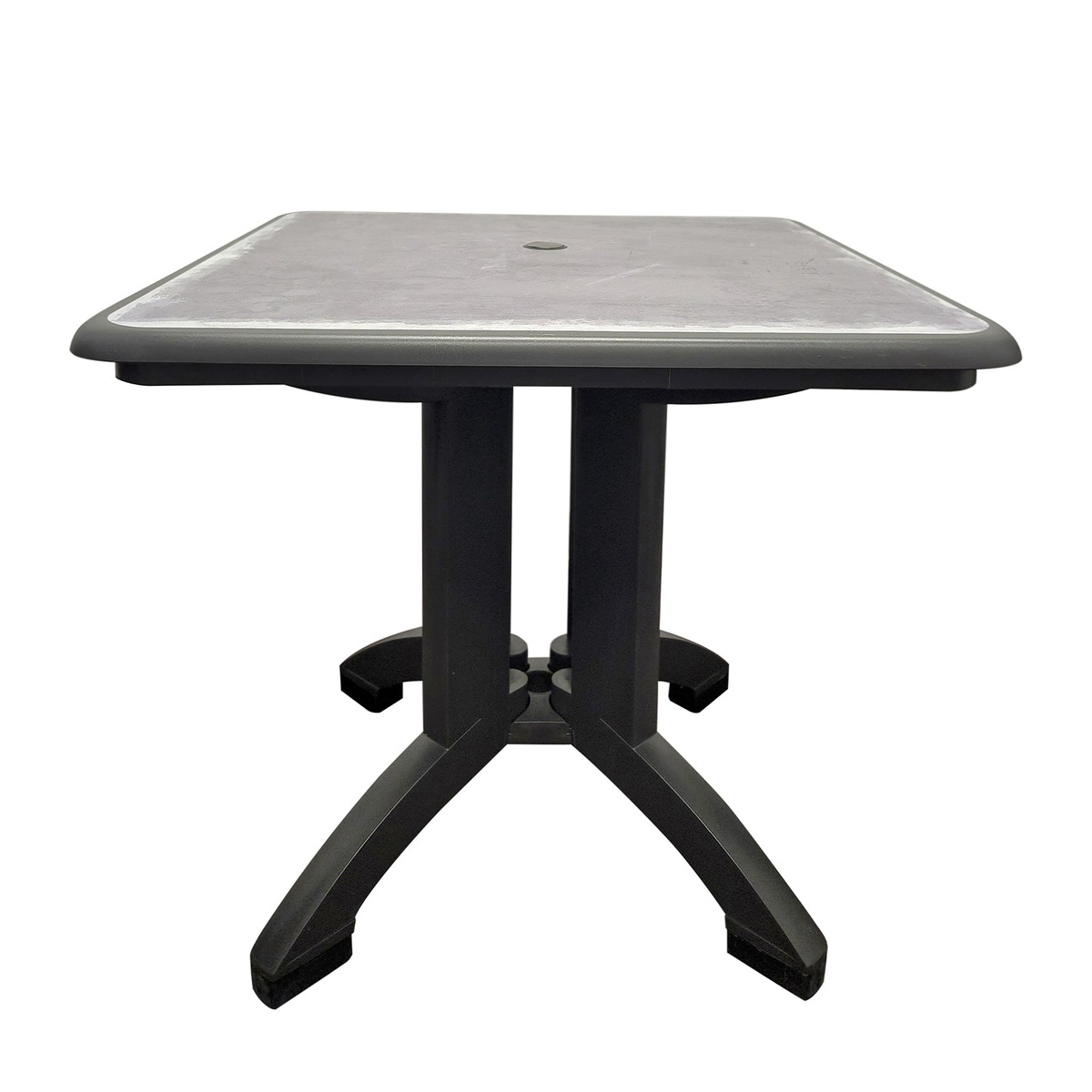 Grosfillex Aquaba 32-inch square resin table in zinc tabletop with charcoal pedestal base, umbrella hole visible at center