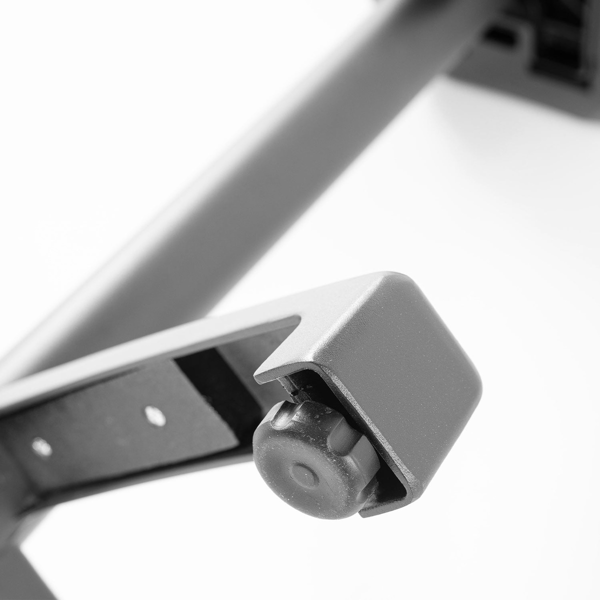 Close-up of Grosfillex X-One adjustable leg leveler foot detail on table base