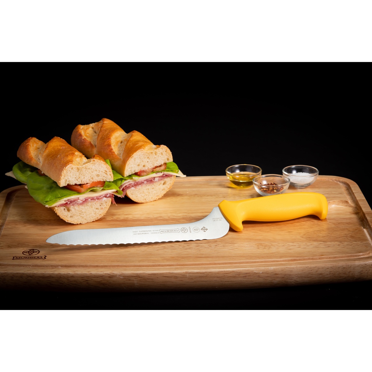 Mundial 9-inch offset serrated sandwich knife with yellow handle